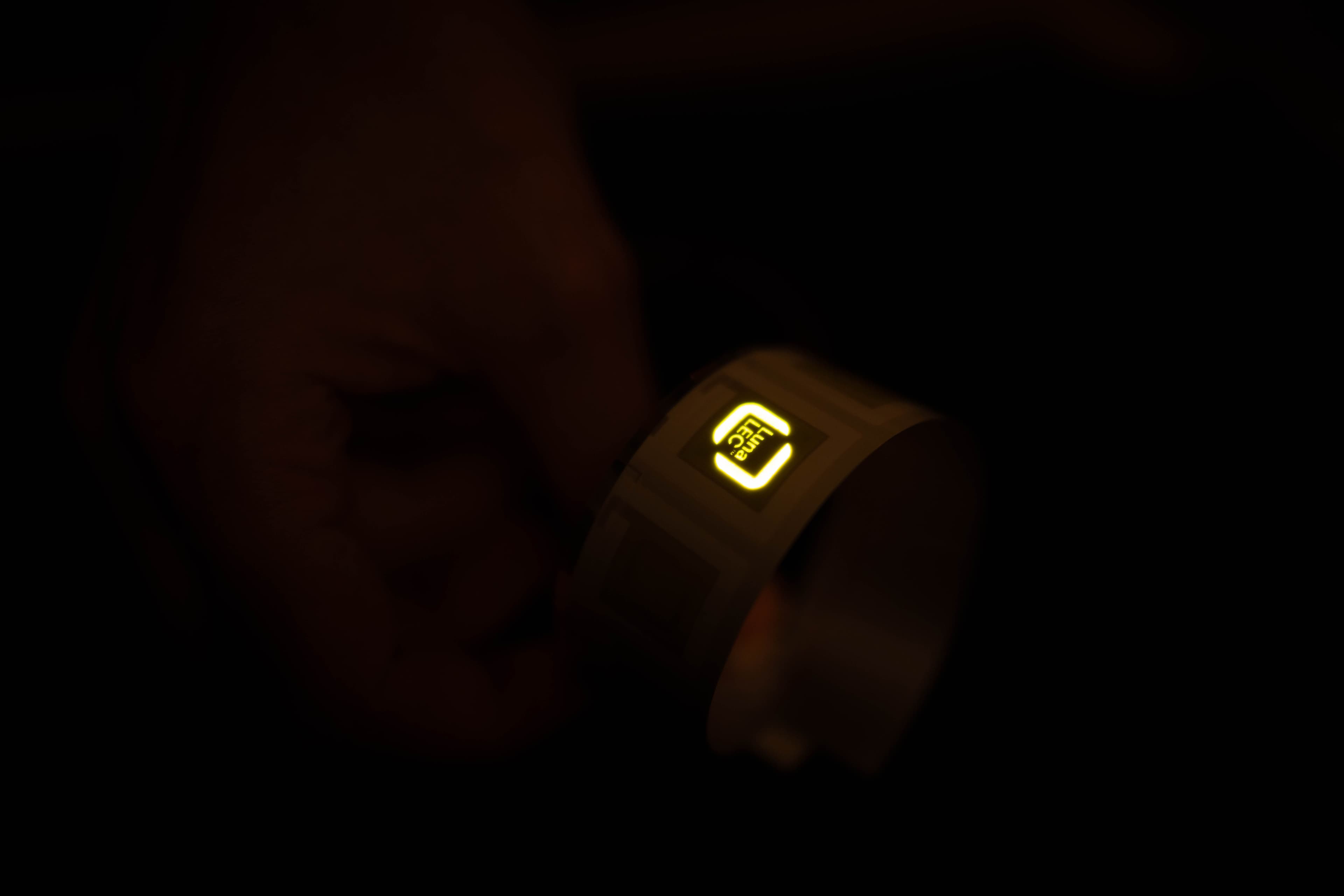 Macro of a printed LEC chip with the LunaLEC logo glowing